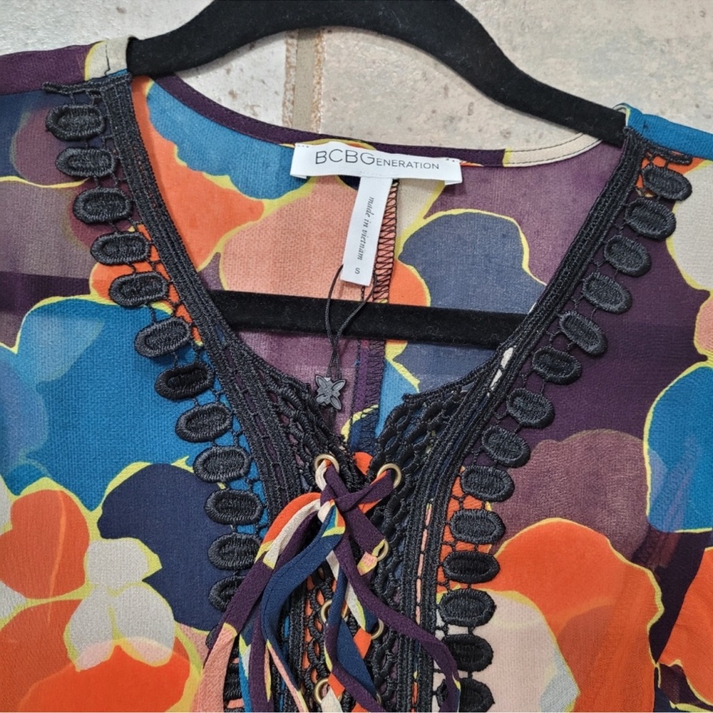 NEW BCBGeneration bishop sleeve multicolored top lace embroidery tie closure